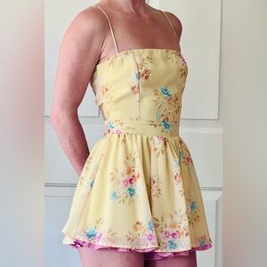 Size XS Lucy in the sky yellow floral romper.